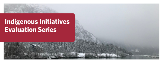 Indigenous Initiatives Evaluation Series. Image: A hillside with trees covered in snow, water at the bottom of image, fog