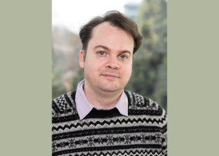 A headshot of Dr. Alexander Ross